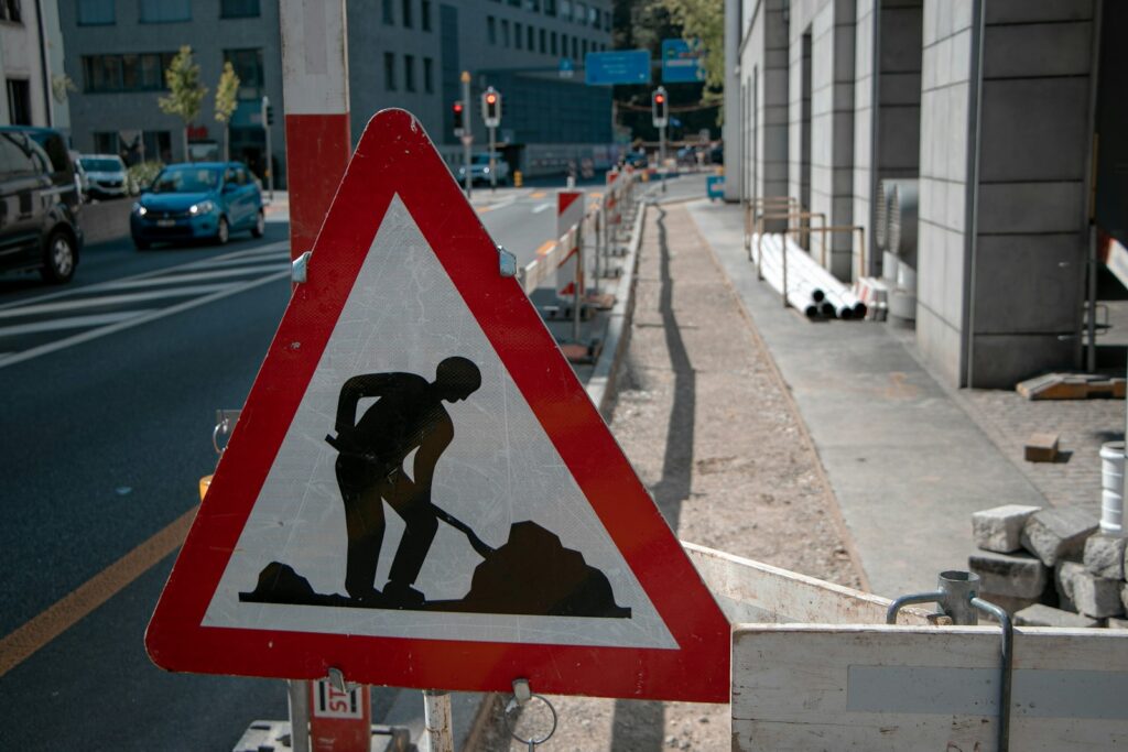 red and white construction sign